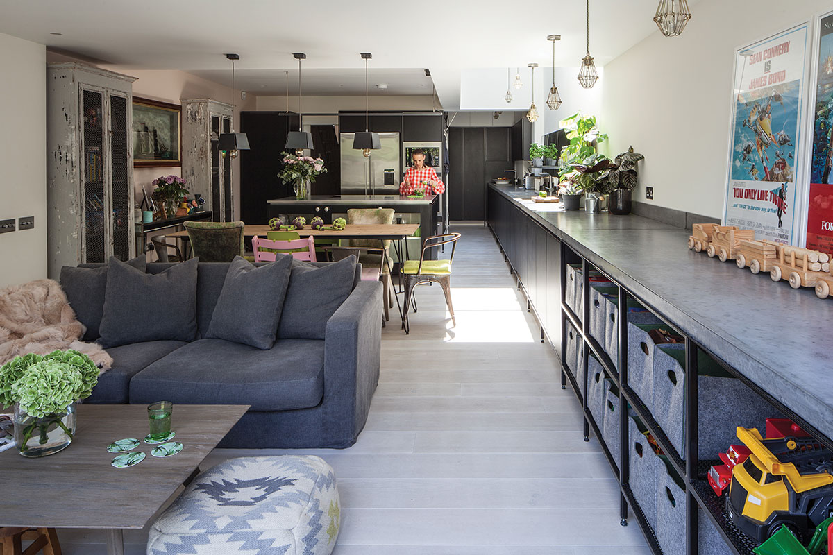 Industrial-style kitchen with a sitting area and long run of cabinetry