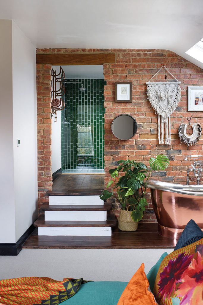 Steps lead up to an ensuite featuring a walk-in shower