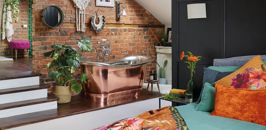 a copper bath in the main bedroom