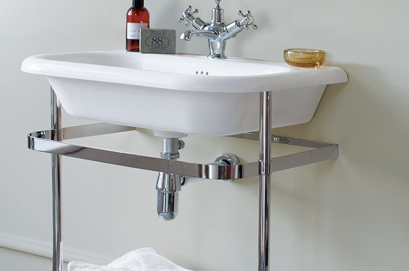 modern pedestal basin with metal base - a potential purchase when buying a bathroom