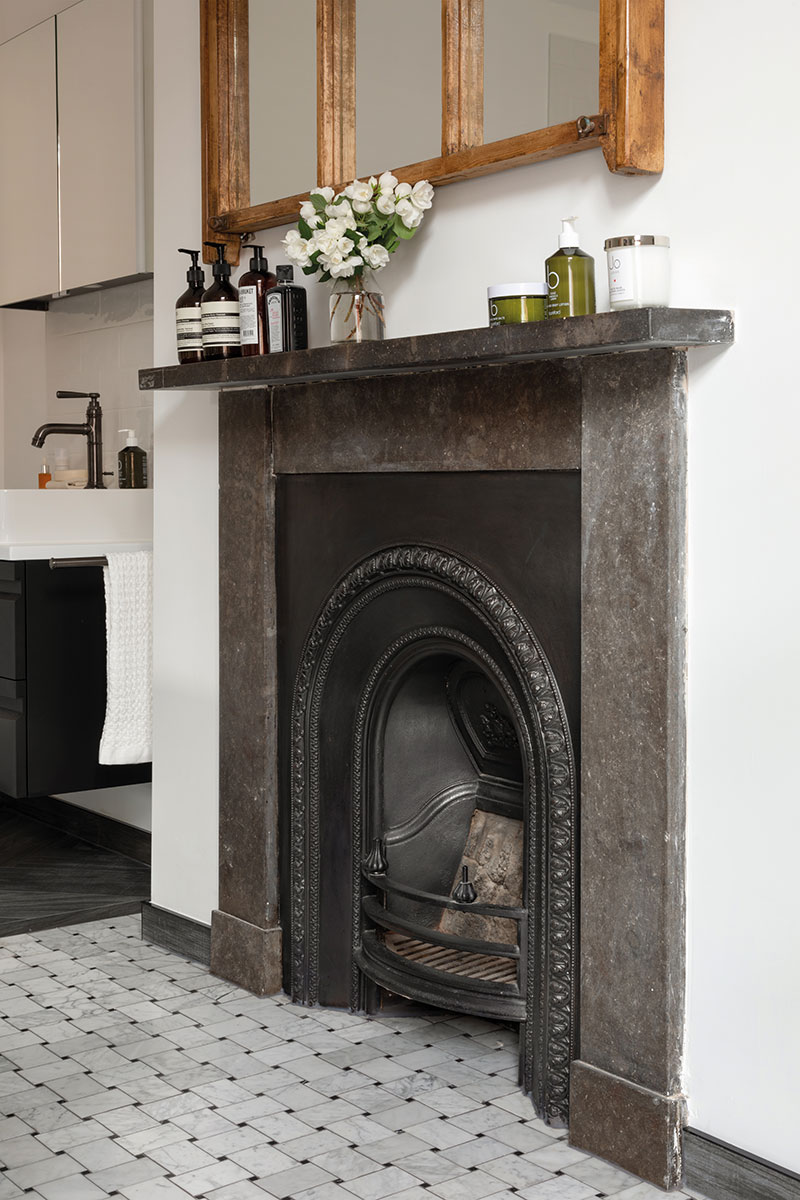 An original fire-place in a bathroom design