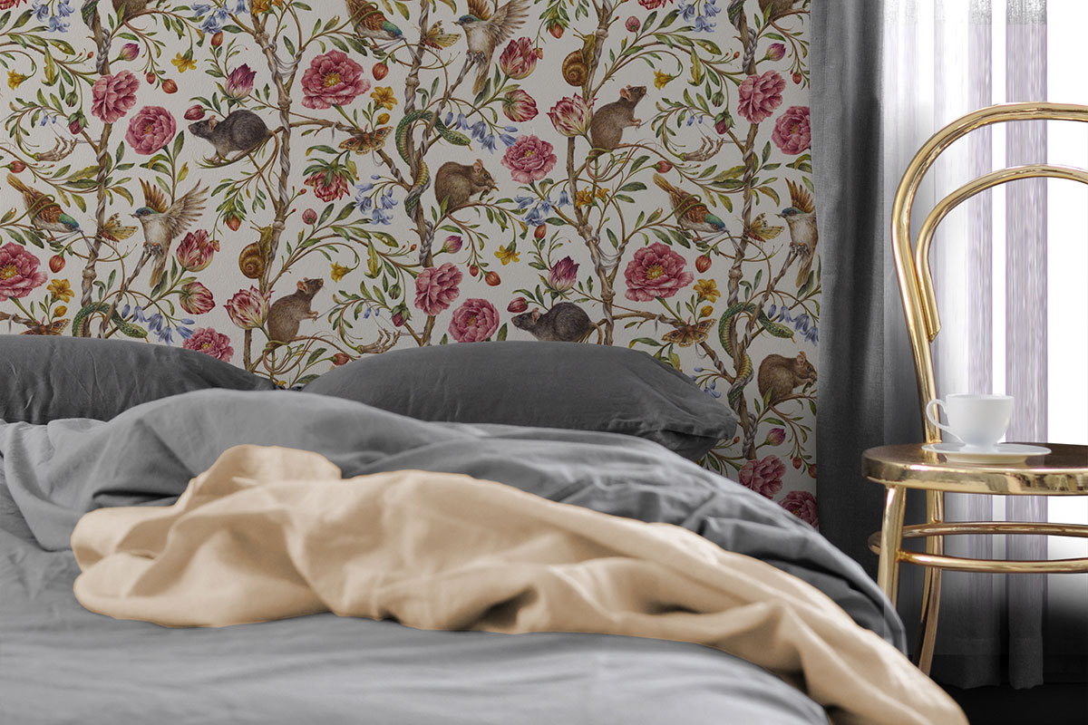 Bedroom with neutral bedding and floral patterned wallpaper