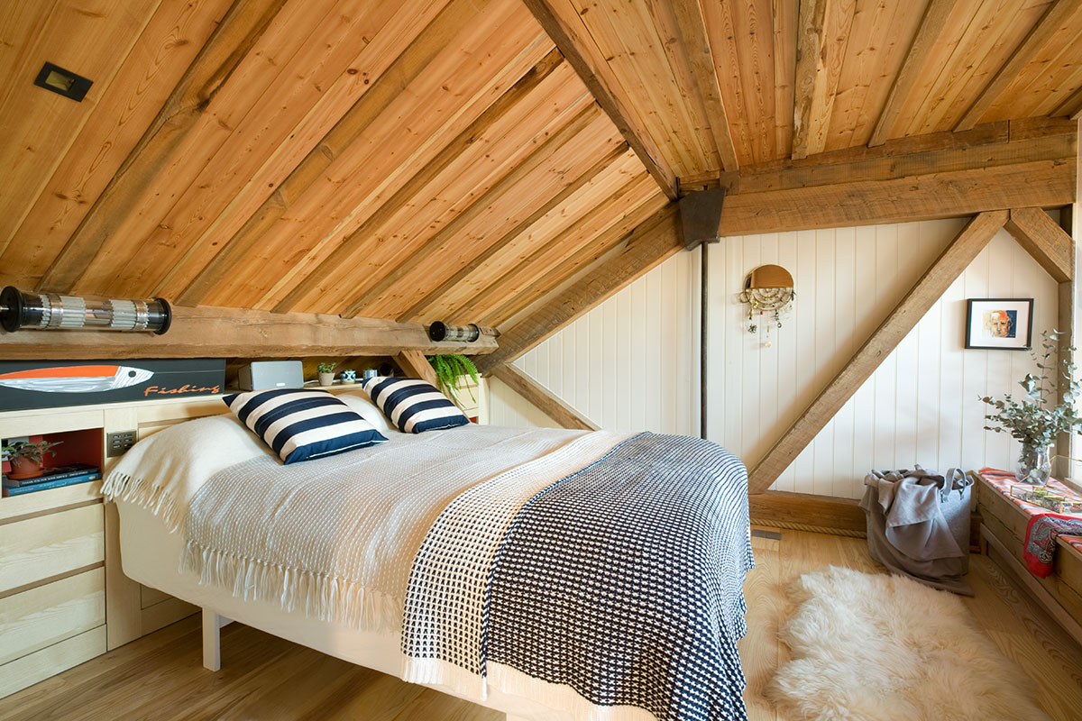 scandi inspired bedroom with wood panel ceiling
