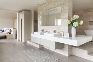 The bedroom zone flows into the bathroom