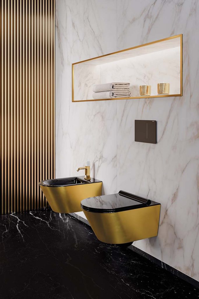 Gold and black toilet and bidet