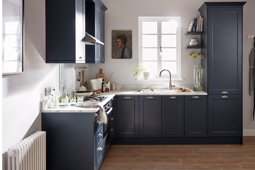a blue shaker-style kitchen featuring traditional navy cabinetry