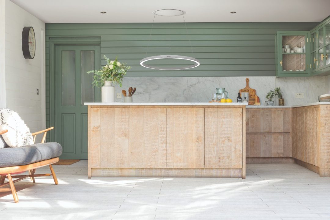 a Caple statement extractor hanging over a wooden kitchen island