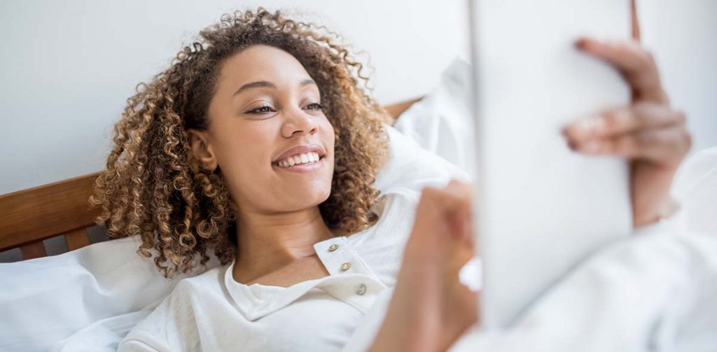 a woman browsing the internet in order to buy a new kitchen in lockdown