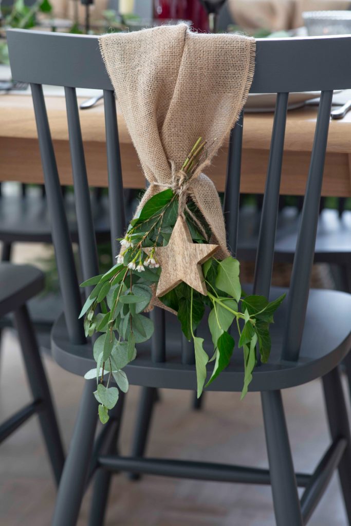 Scandi-inspired chair decoration with stars and greenery