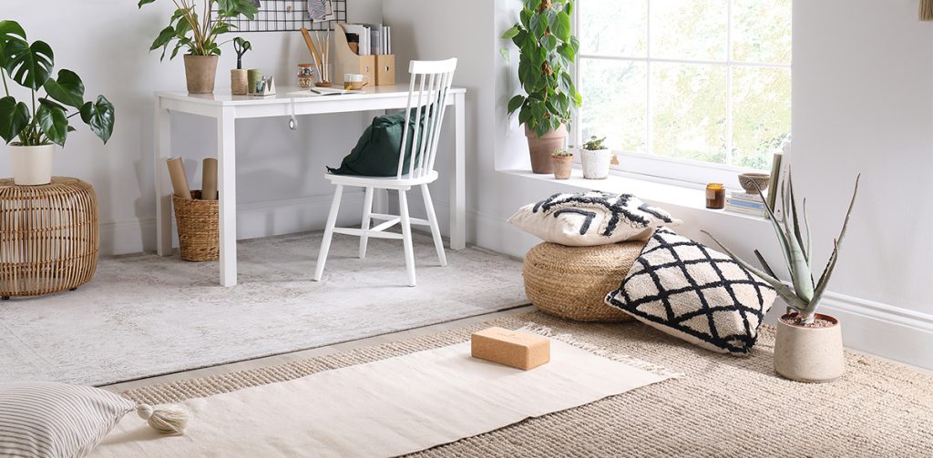 the white wooden Milton table from Furniture Choice in a rustic living room with natural rattan textures