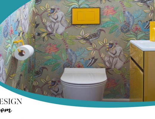 how to design a cloakroom such as this loo featuring floral wallpaper and a yellow flush button