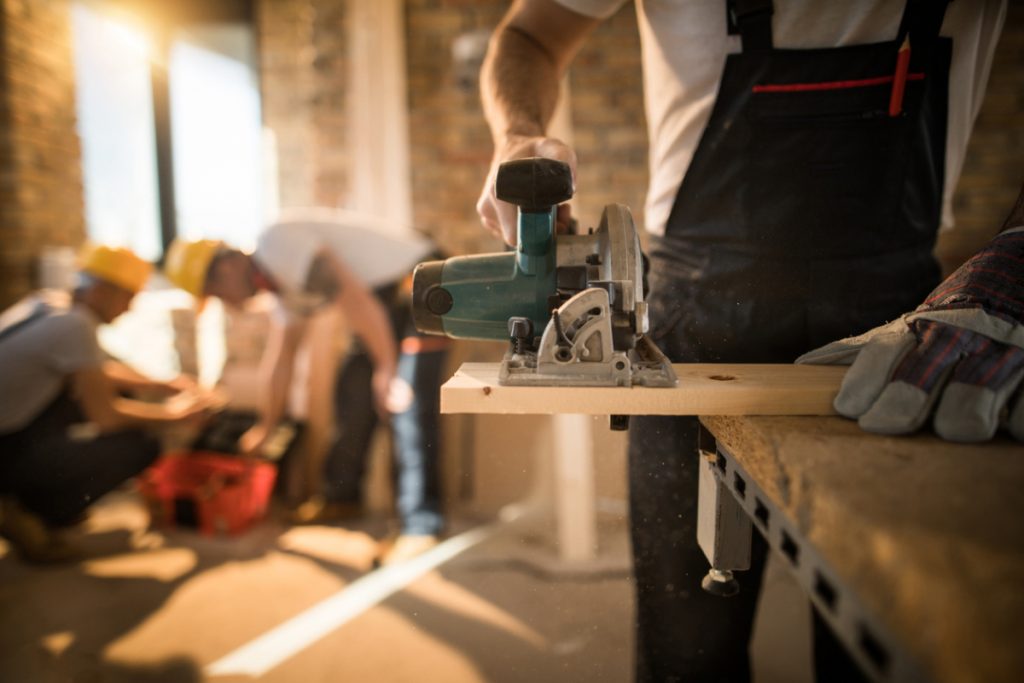 A man using a sander