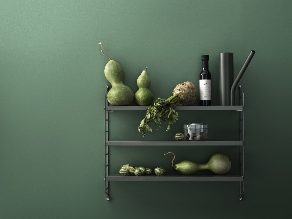 a set of shelves holding fruit, vegetables and accessories