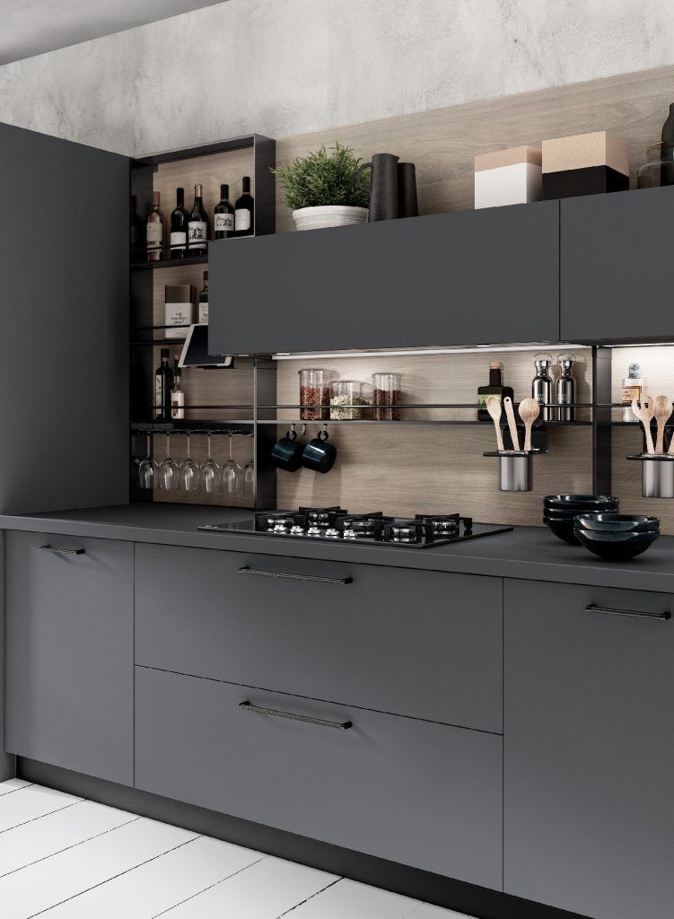 a small kitchen painted in an anthracite colour with open shelving showcasing wine bottle and wooden utensils