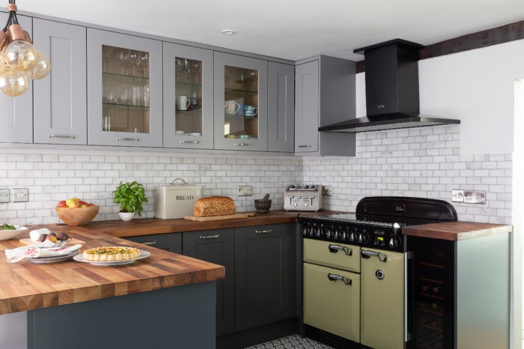 The Marlborough design in Graphite with grey metro brick tiles, grey cabinetry and a walnut butcher's block worktop