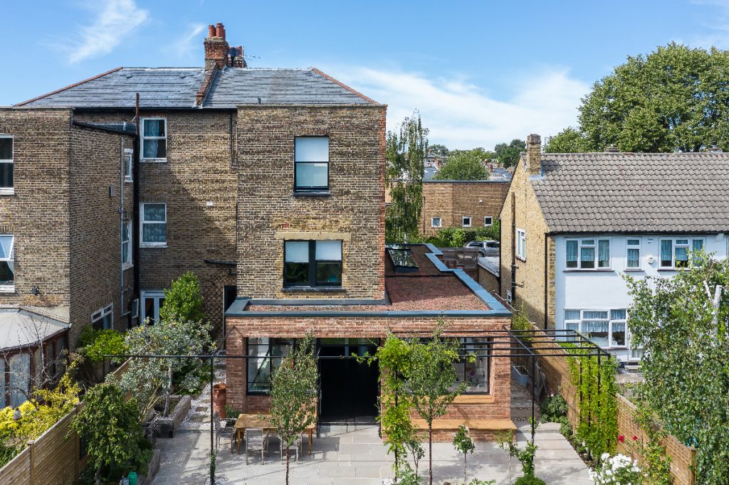 steel-framed glazing on a three-storey house