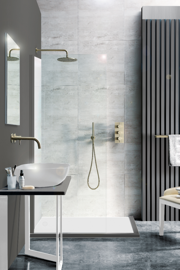 A luxury stand up grey marble shower with a rain shower head with