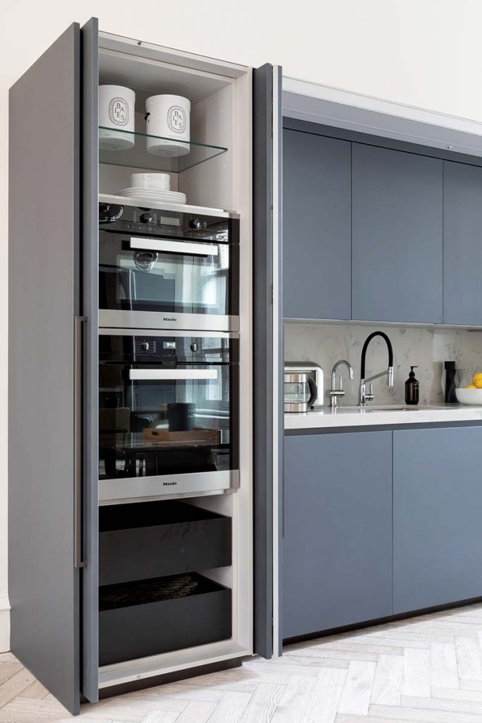 pocket doors housing a microwave and oven