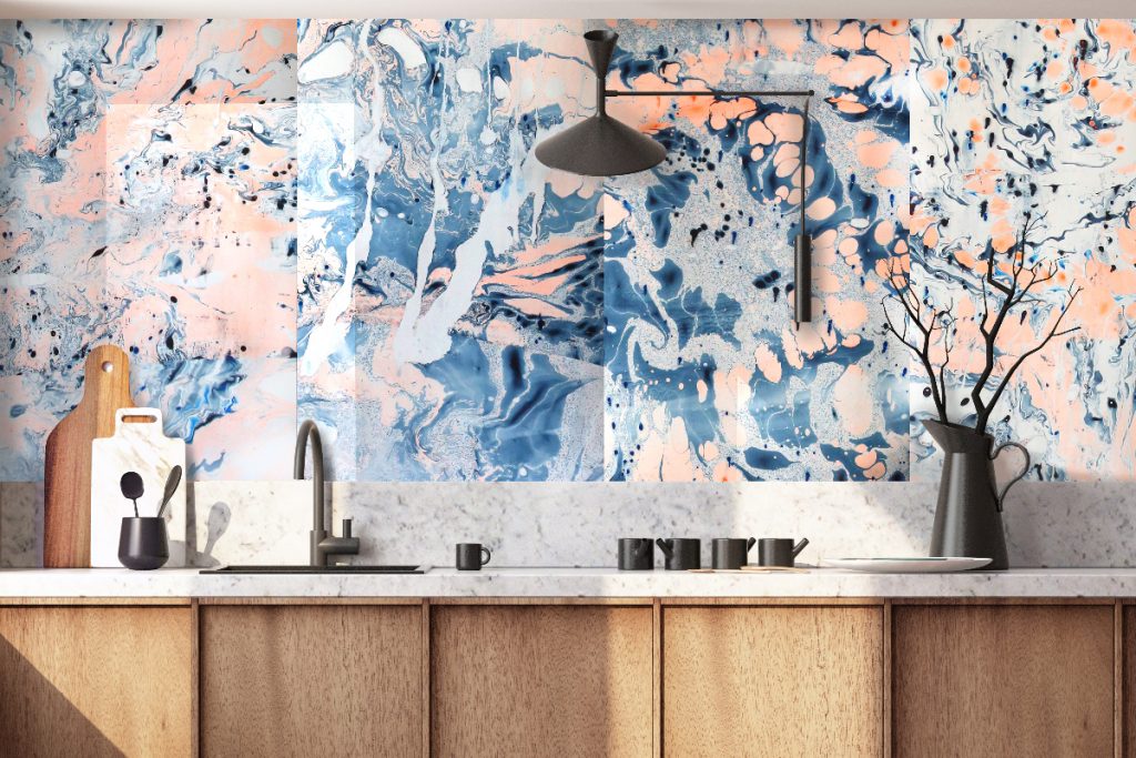 a blue and neon orange mural above a grey splashback and wooden cabinetry