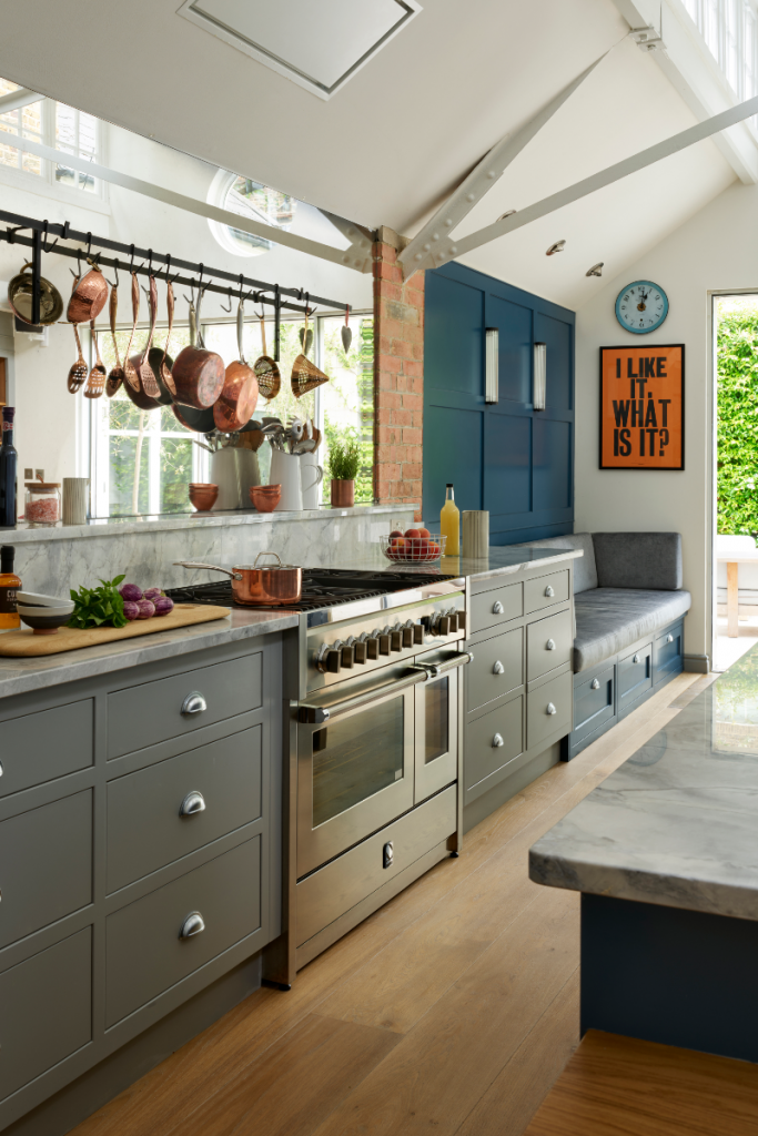 Natural Quartzite worktops with grey cabinetry and inbuilt seating