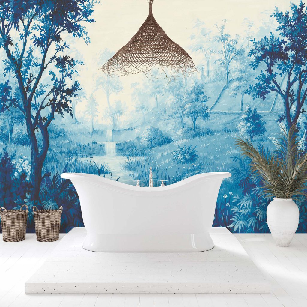 a Nidra Ink blue wall mural behind a white freestanding bath