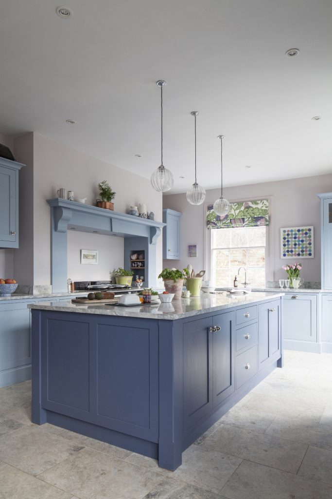 a pale lavender Alexander Lewis design with three pendant lights above an island