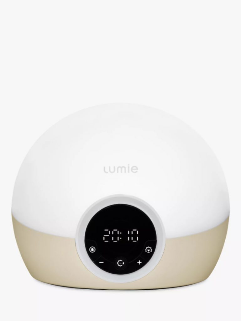 a white and beige body clock lamp from Lumie