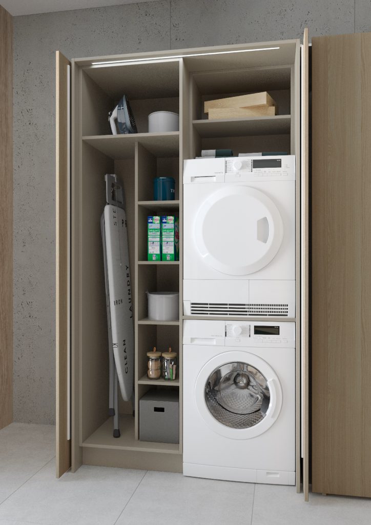 an ironing board housed in oak cabinetry with a washing machine and tumble dryer and several accessories