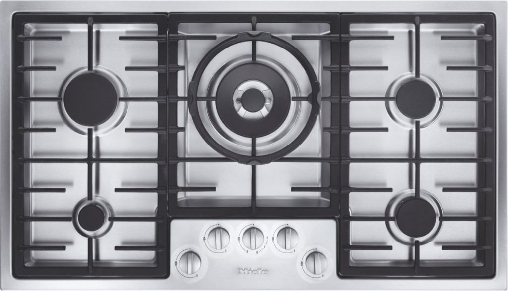 the Miele KM 2354 cooker with silver dials and black pan supports