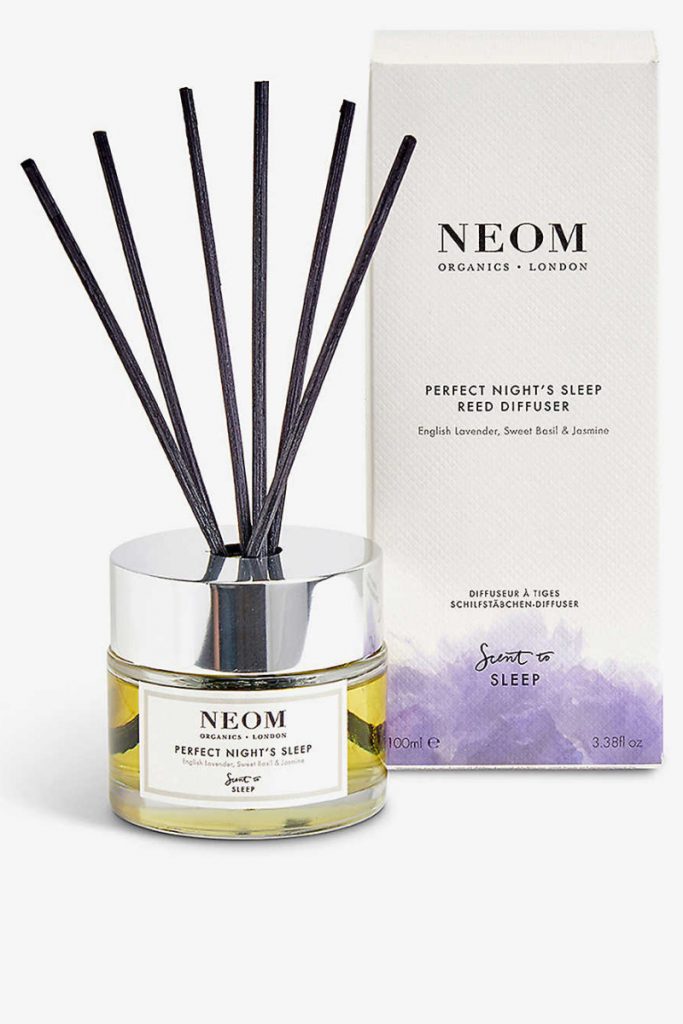 a yellow and purple reed diffuser from Neom