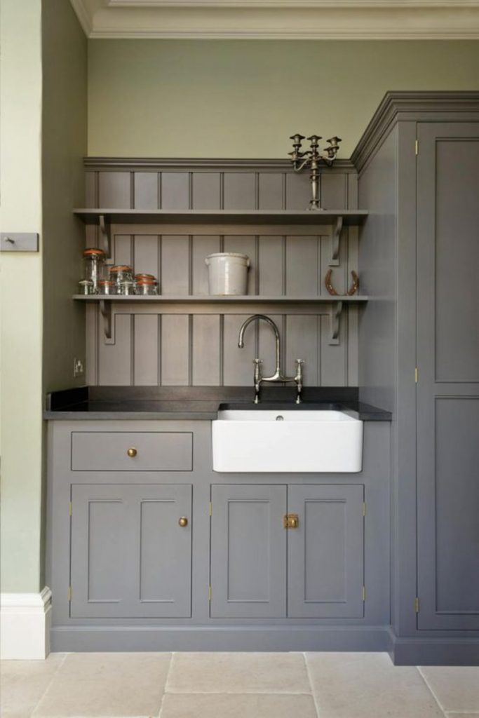 the deVOL South Downs House featuring classic shaker cabinetry painted grey and a white Belfast sink