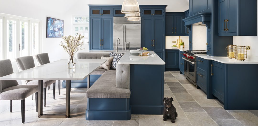 a navy kitchen with banquette seating