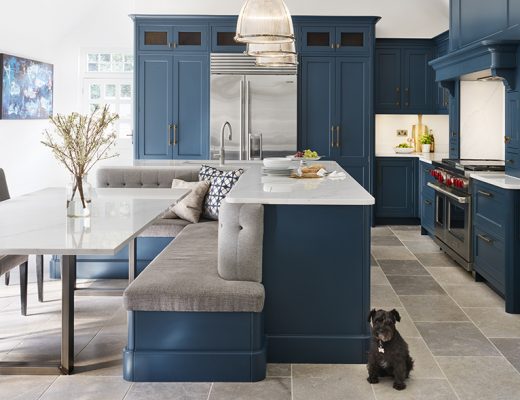 a navy kitchen with banquette seating