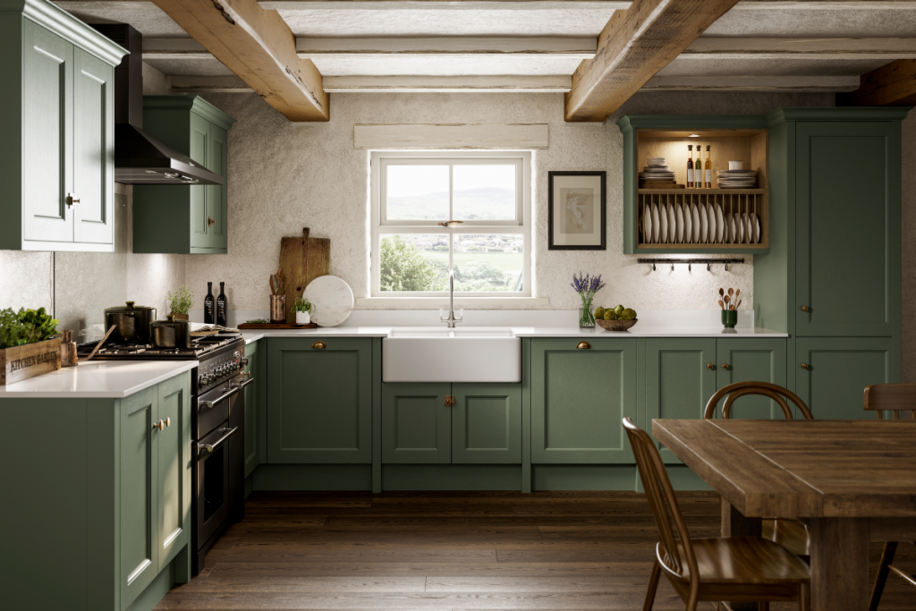 an olive green Shaker kitchen with brass cup handles 