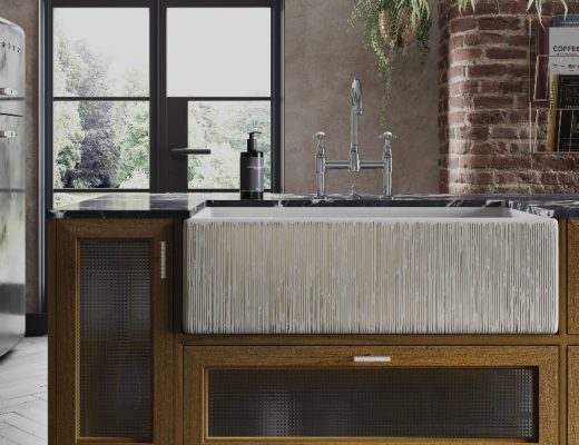 a ribbed white Belfast sink on a wooden counter top