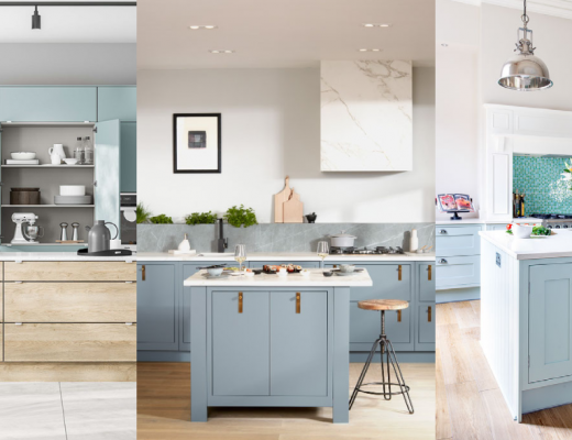 a pale blue kitchen with brass fittings and a central white and blue island