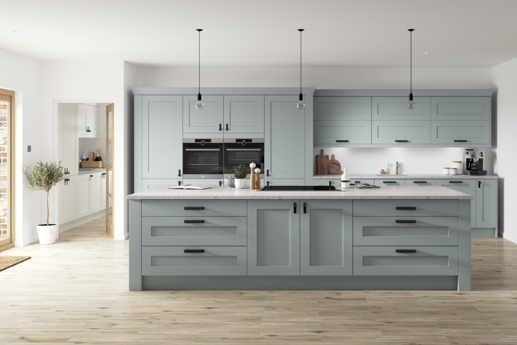 muted pastel cabinetry with matt black handles