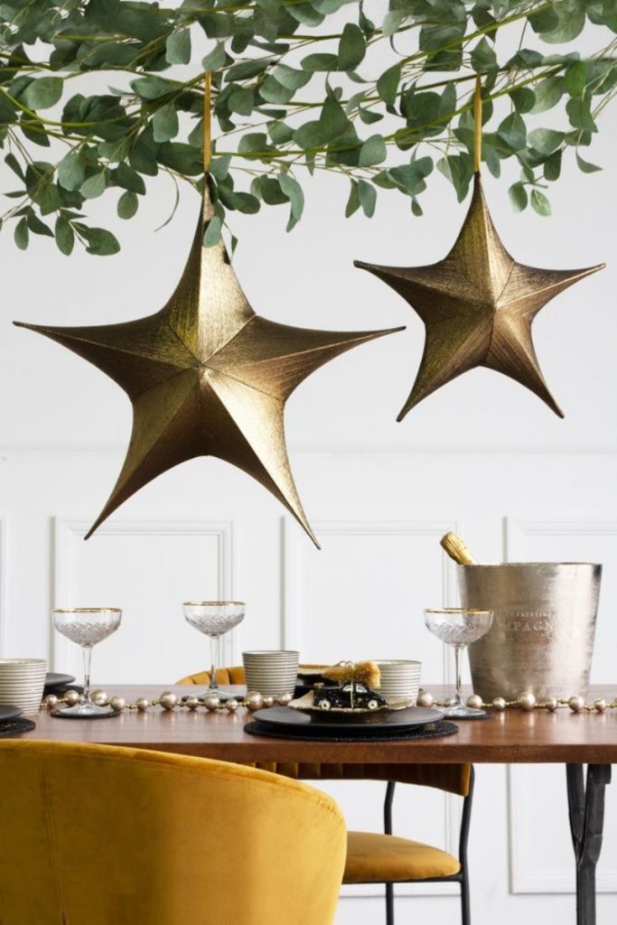 Christmas tablescaping ideas with gold, hanging stars