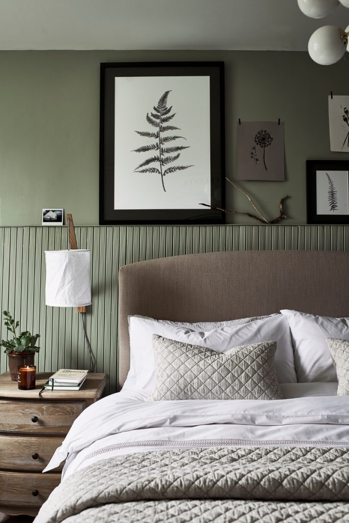 muted wall panelling behind a bed