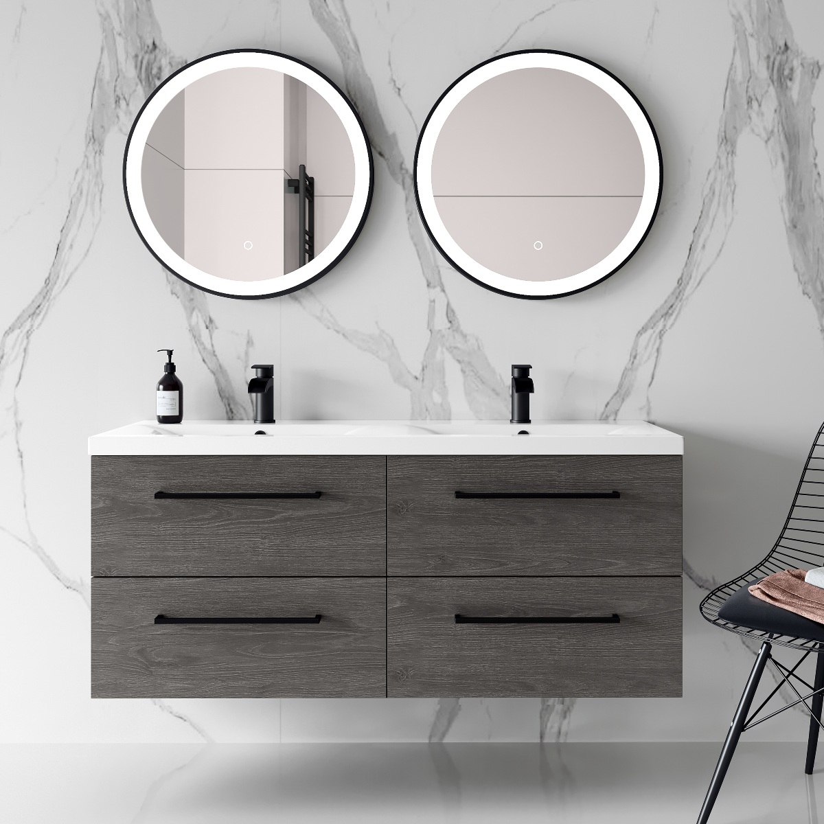 a dark wood double vanity unit with two sinks, lots of storage, matt black taps and two round illuminated mirrors