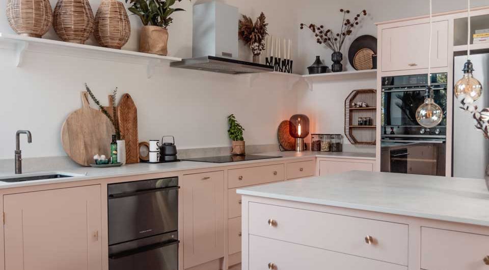 rustic beams above pastel cabinetry