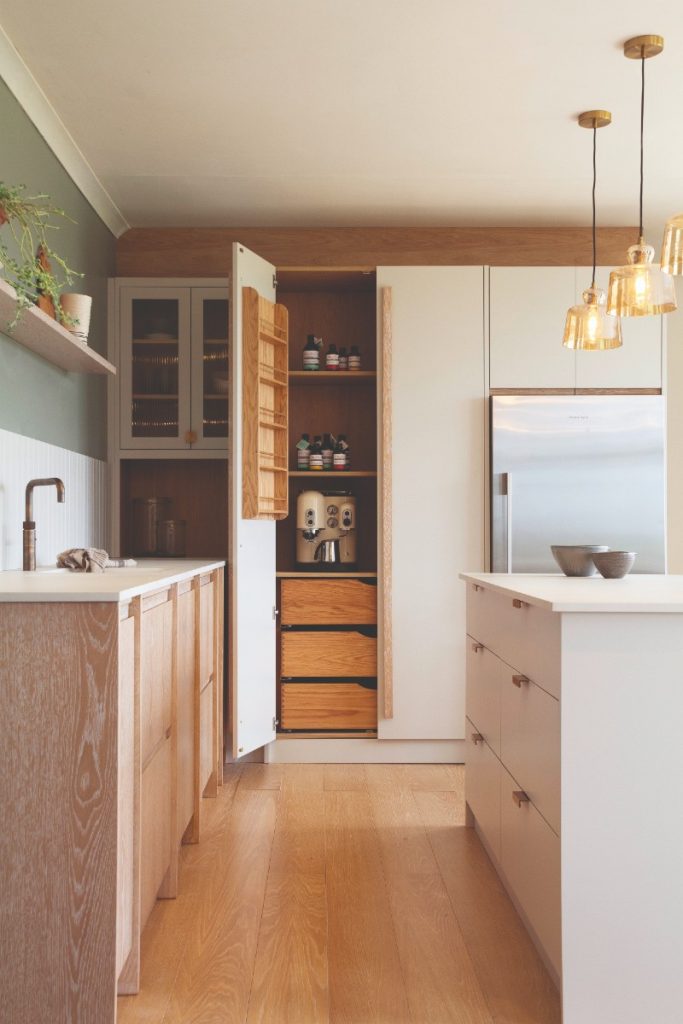 an oak and white kitchen that generates good flow 