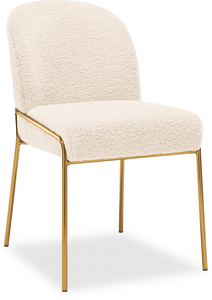 a cream bouclé chair with gold legs
